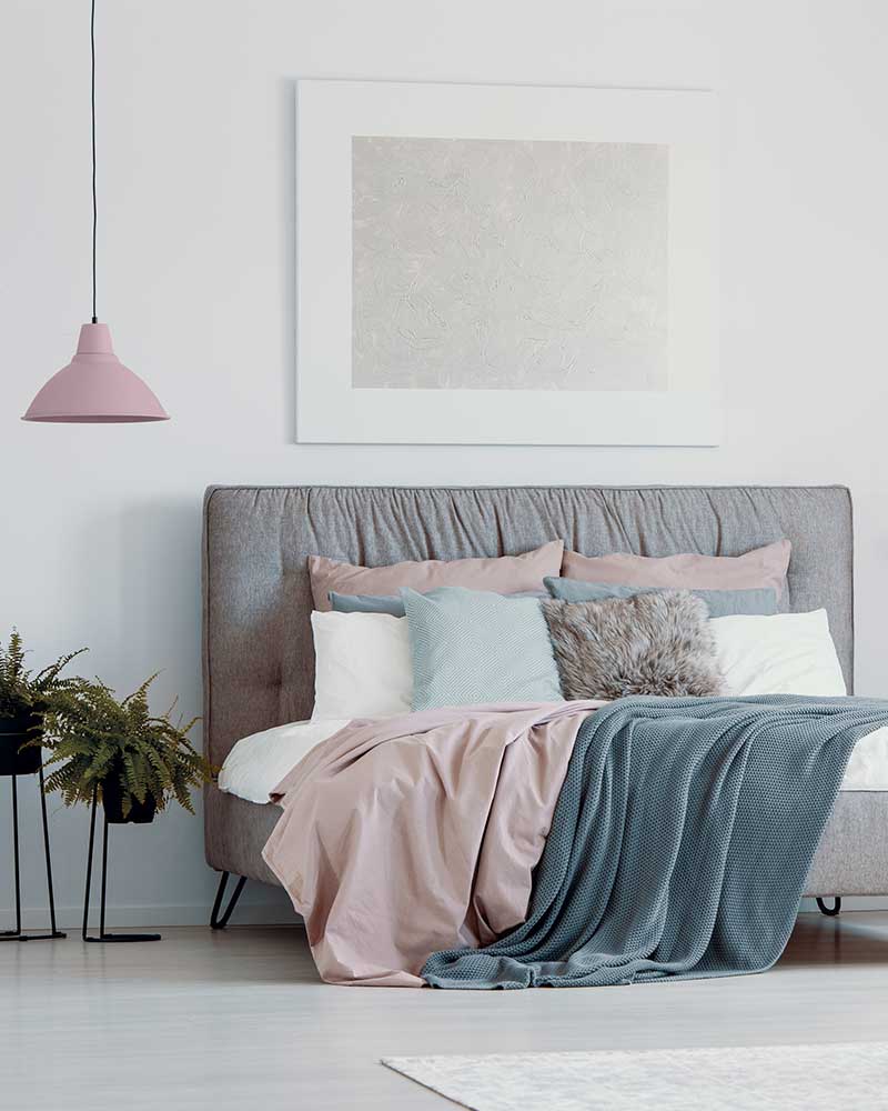 how high to hang pictures - above the bed